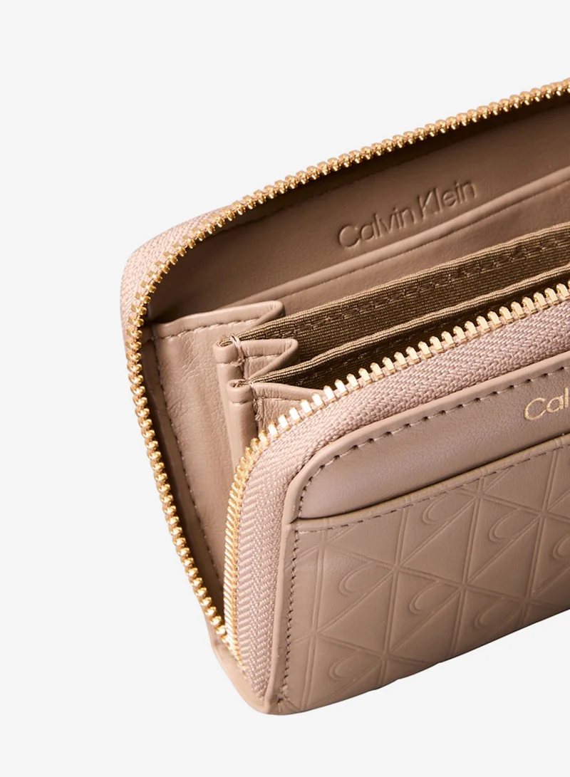 CALVIN KLEIN  Embossed Emblem Logo Zip Wallet for Women | Best Price UAE